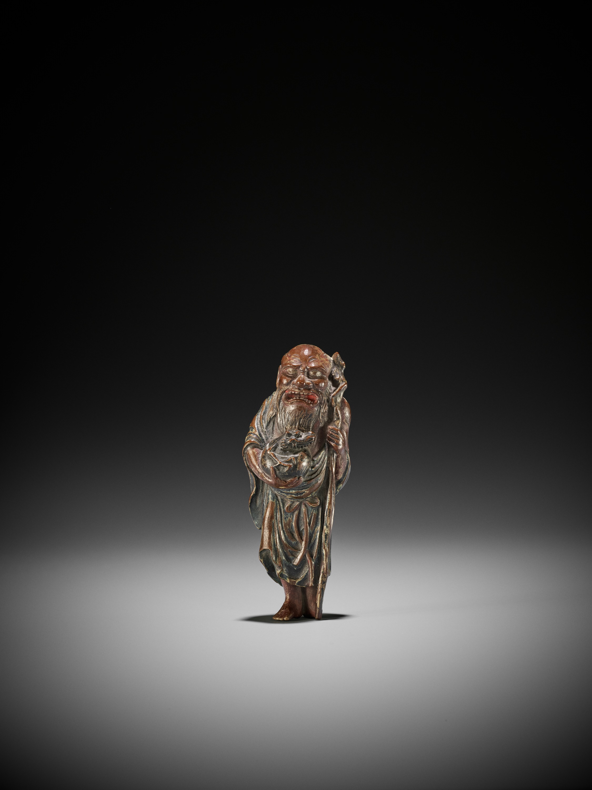 Lot 277 - A SUPERB SAISHIKI NETSUKE OF CHINNAN SENNIN,