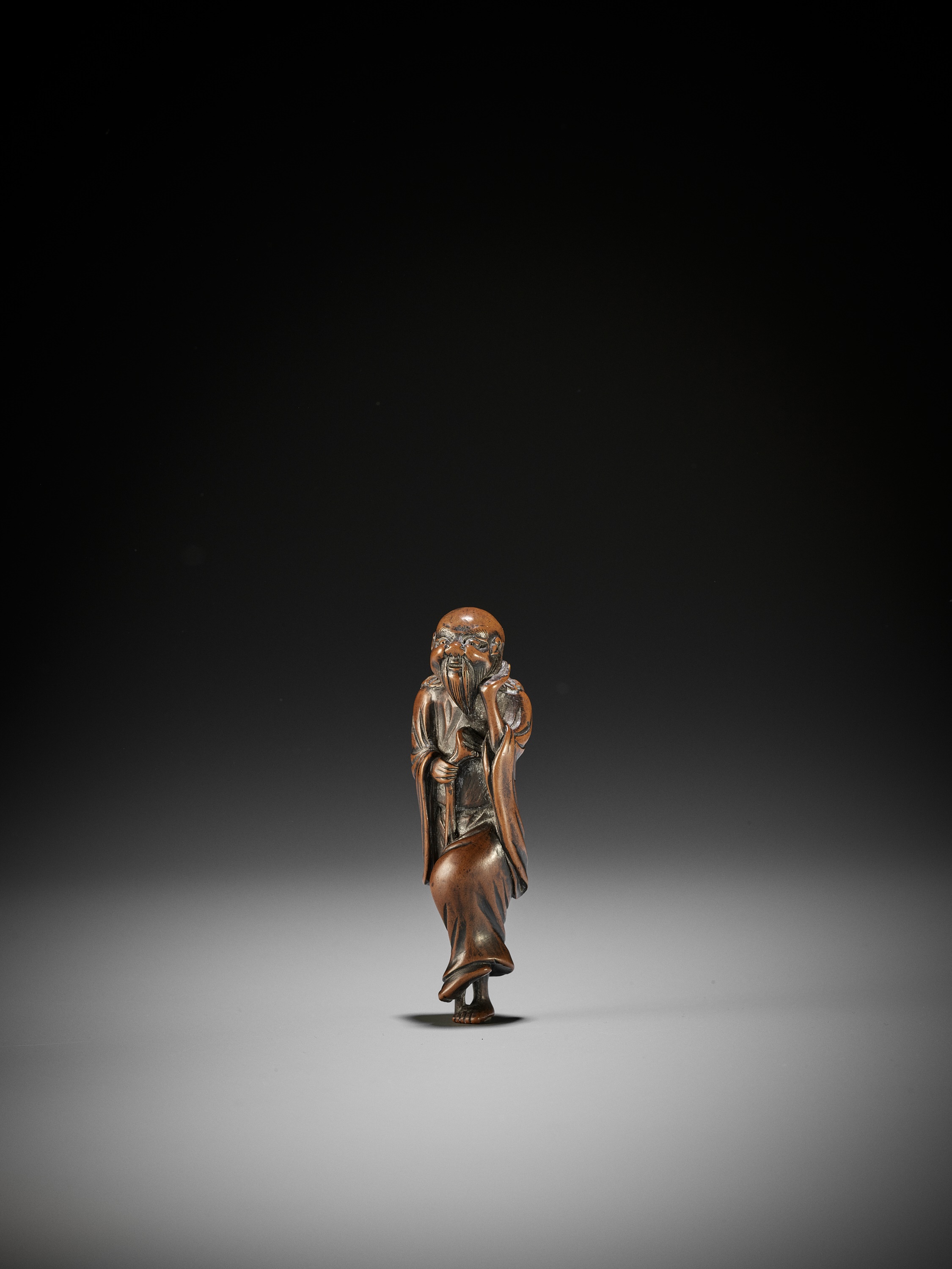 Lot 273 - A WOOD NETSUKE OF TEKKAI SENNIN