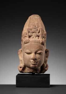 Lot 591 - A RED SANDSTONE HEAD OF VISHNU WITH A MITER CROWN