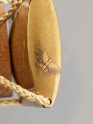Lot 334 - KAJIKAWA: A FINE GOLD LACQUER THREE-CASE INRO WITH A FLOWERPOT AND BUTTERFLIES