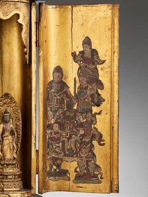 Lot 121 - A RARE LACQUER ZUSHI (PORTABLE BUDDHIST SHRINE) WITH A TRIAD OF AMIDA AND ACOLYTES