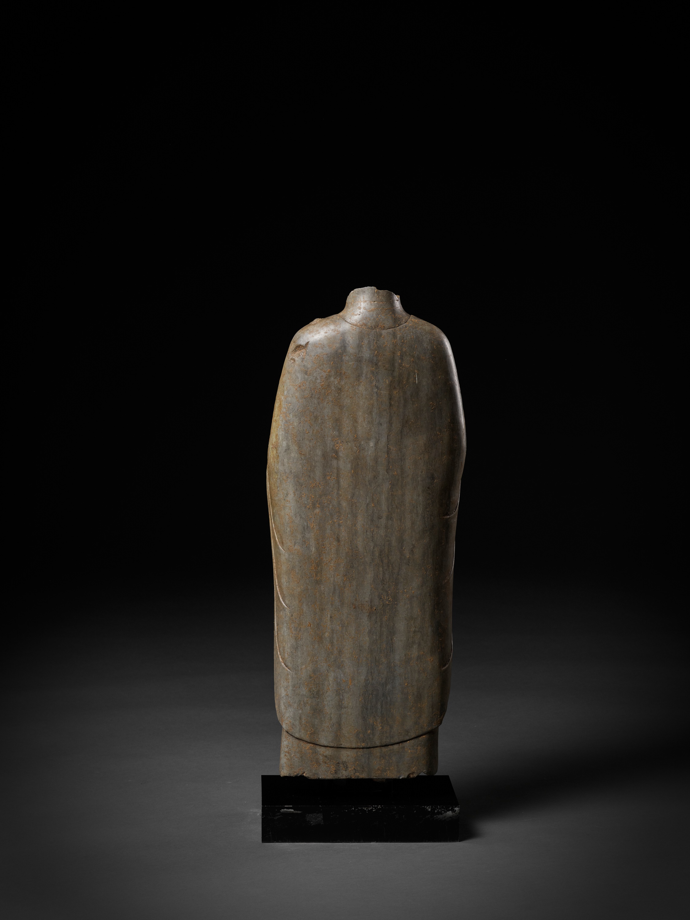 Lot 375 - A LIMESTONE TORSO OF BUDDHA, NORTHERN QI