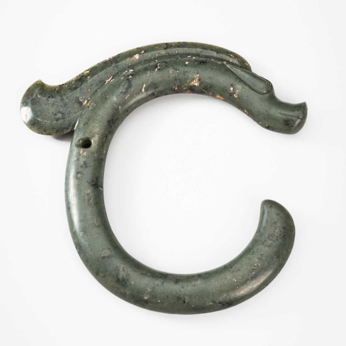 A LARGE GREEN JADE ‘C-SHAPED DRAGON' PENDANT, HONGSHAN CULTURE