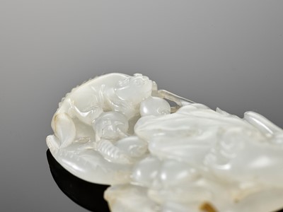 Lot 450 - A WHITE JADE ‘SQUIRRELS AND GRAPES’ PENDANT, 18TH CENTURY