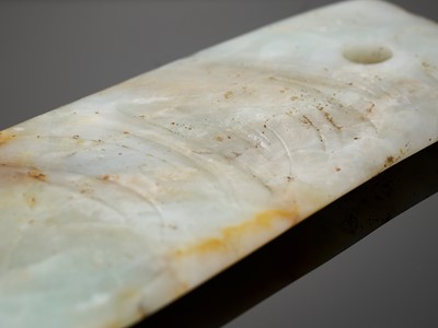 Lot 142 - A CELADON AND RUSSET JADE AXE, NEOLITHIC PERIOD