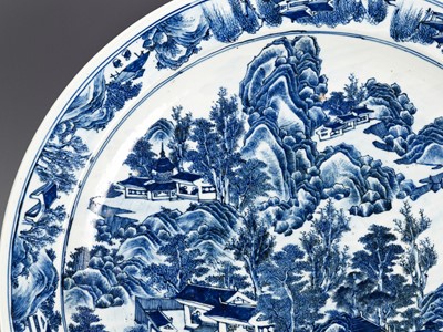 Lot 420 - A MONUMENTAL BLUE AND WHITE ‘LANDSCAPE’ CHARGER, KANGXI PERIOD