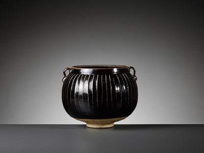 Lot 471 - A BLACK-GLAZED RIBBED JAR, NORTHERN SONG TO JIN DYNASTY