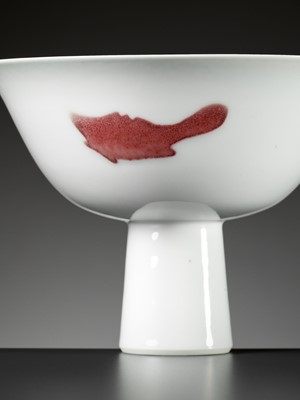 Lot 505 - A COPPER-RED-DECORATED ‘THREE FISH’ STEM CUP, YONGZHENG MARK AND PERIOD