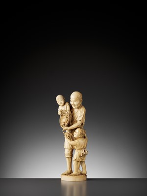Lot 644 - A LARGE AND IMPRESSIVE IVORY OKIMONO OF A FAMILY FISHING FOR TURTLES