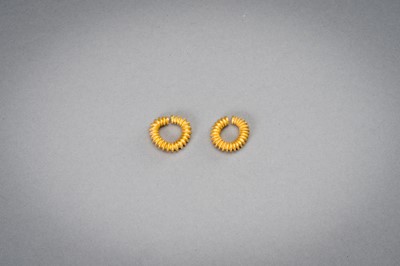 Lot 1155 - A PAIR OF EARLY CAMBODIAN RIBBED GOLD EARRINGS