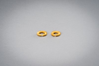 Lot 1155 - A PAIR OF EARLY CAMBODIAN RIBBED GOLD EARRINGS