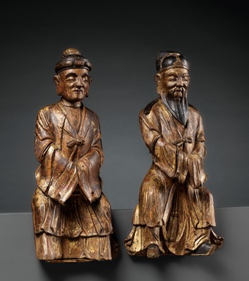 Lot 30 - A PAIR OF GILT-LACQUERED HARDWOOD FIGURES OF DAOIST IMMORTALS, MING DYNASTY