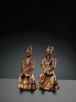 Lot 30 - A PAIR OF GILT-LACQUERED HARDWOOD FIGURES OF DAOIST IMMORTALS, MING DYNASTY