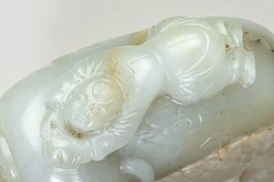 Lot 276 - A PALE CELADON JADE CARVING OF AN ELEPHANT AND BOY