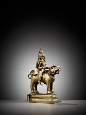 Lot 702 - A BRONZE FIGURE OF DURGA RIDING A LION, INDIA, 15TH CENTURY
