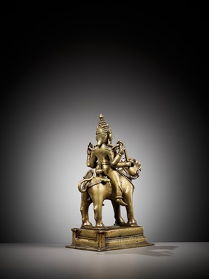Lot 702 - A BRONZE FIGURE OF DURGA RIDING A LION, INDIA, 15TH CENTURY