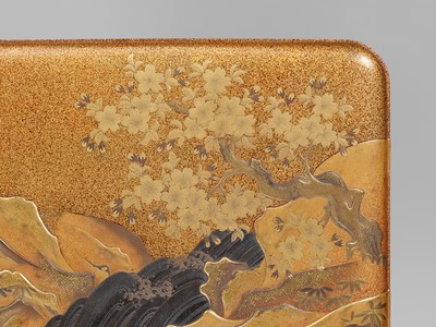 A SUPERB GOLD LACQUER SUZURIBAKO WITH WEDDED ROCKS MOTIF