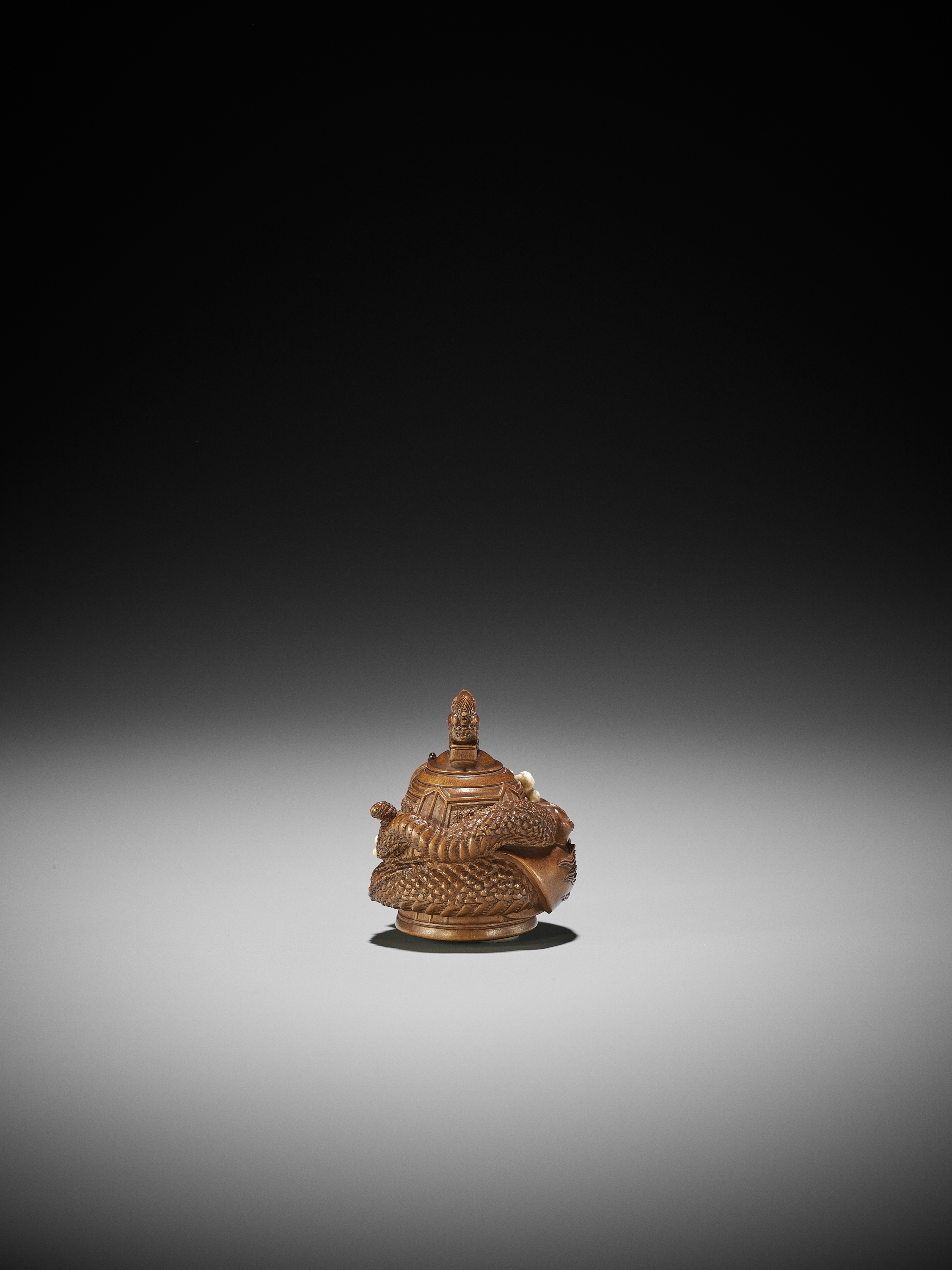 Lot 149 - MINKO: A FINE INLAID WOOD NETSUKE OF