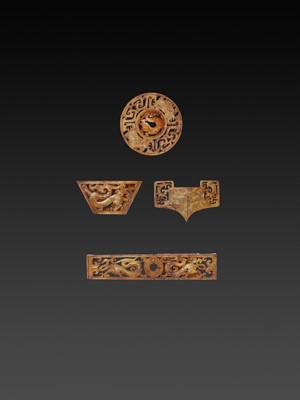A RARE AND IMPORTANT SET OF FOUR JADE OPENWORK SWORD FITTINGS, WESTERN HAN
