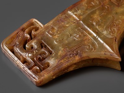 Lot 39 - A RARE AND COMPLETE SET OF FOUR JADE OPENWORK SWORD FITTINGS, WESTERN HAN DYNASTY