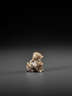 Lot 107 - A JADE CARVING OF A BIXIE, SIX DYNASTIES