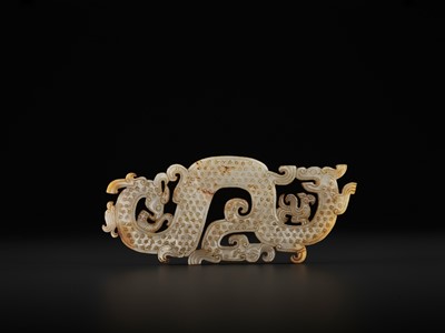 A LARGE AND IMPORTANT WHITE JADE ‘DRAGON AND PHOENIX’ PENDANT, WARRING STATES