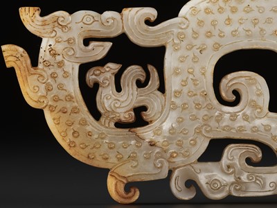 Lot 71 - A LARGE AND IMPORTANT WHITE JADE ‘DRAGON AND PHOENIX’ PENDANT, WARRING STATES